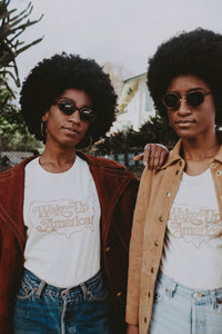 Two women wearing sunglasses and Wake Up America Shirt for Women by The Bee and The Fox