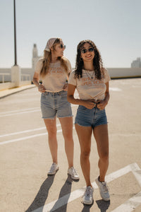 Two women in a parking lot wearing Behind Every Great Woman There's a Shit Ton of Other Dope Ass Women Shirt by The Bee and The Fox